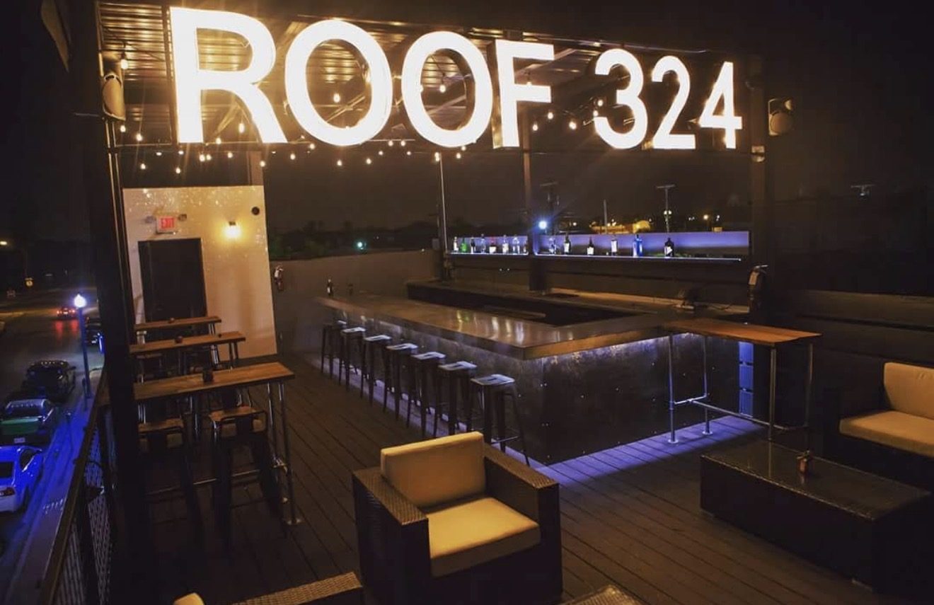 Roof 324 — open-air rooftop bar at night with illuminated ROOF 324 marquee